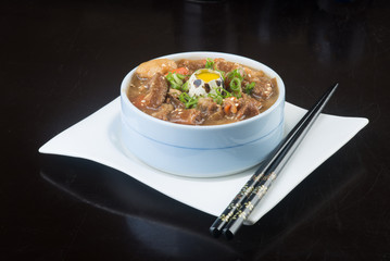 japanese cuisine. beef soup on the background