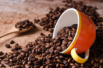 coffee cup and coffee beans around