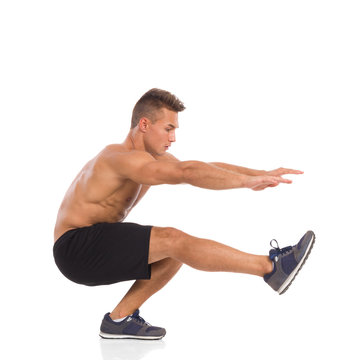 How To Make A One Leg Squat, Side View, Full Length Studio Shot Isolated On White.