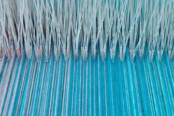 Colorful threads in a loom