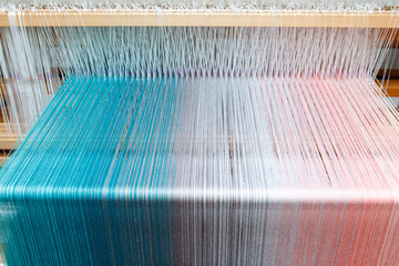 Colorful threads in a loom