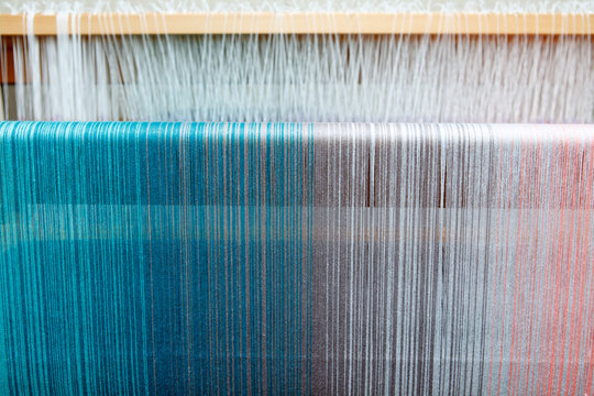 Colorful threads in a loom