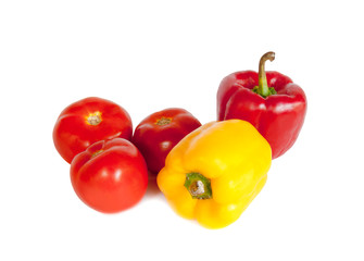 Fresh sweet peppers, tomatoes on a white background