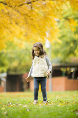 Little girl at the autumn park