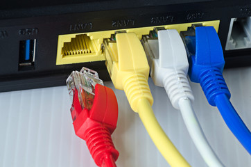 Ethernet cables connect to router or switch