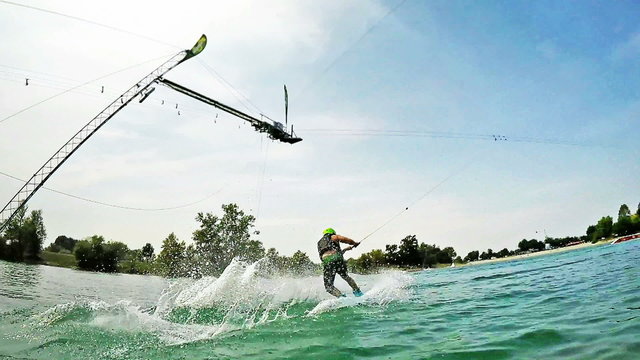 A young wakeboarder in action on the lake