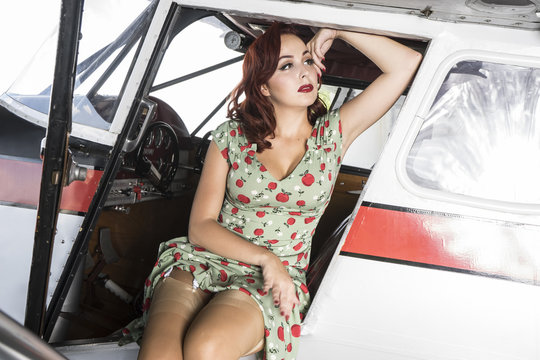 Retro, pinup dressed in era of the Second World War, beauty redh
