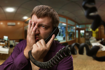 Man speaks on the phone
