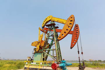 Golden yellow and red Oil pump of crude oilwell rig
