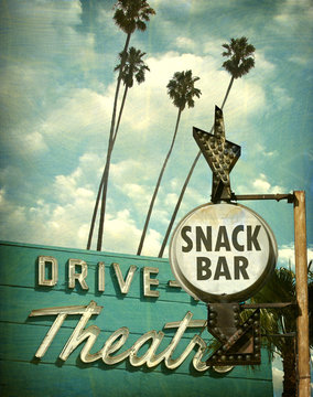 aged and worn vintage photo of drive in theater and snack bar sign