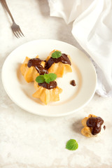 Profiteroles with chocolate sauce