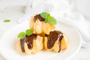Profiteroles with chocolate sauce