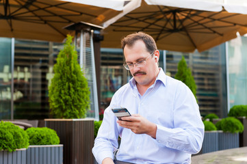 Middle age businessman using smartfone