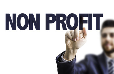 Business man pointing the text: Non Profit