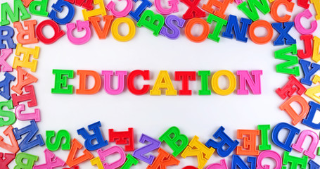 Education written by plastic colorful letters on a white