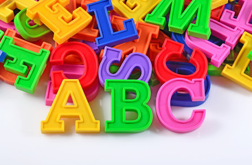 Plastic colored alphabet letters ABC on a white