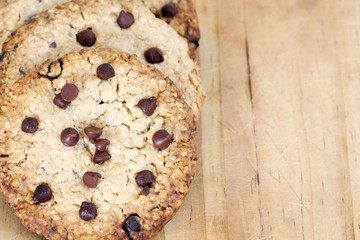 snack: chocolate chip cookies on wooden background  with copy space
