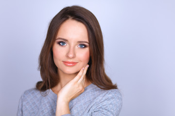 Portrait of an attractive fashionable young brunette woman
