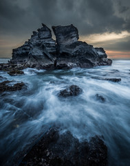 Fototapeta na wymiar sea waves cliff rock dramatic color