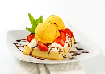 Waffle with ice cream and strawberries