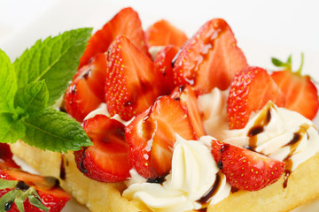 Crisp waffle with  strawberries and cream