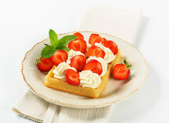 Crisp waffle with  strawberries and cream