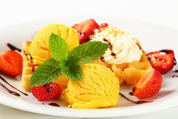 Waffle with ice cream and strawberries