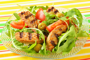 Grilled patty with fresh vegetable salad