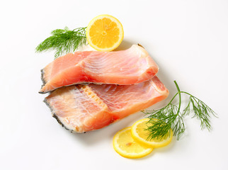 Raw carp fillets