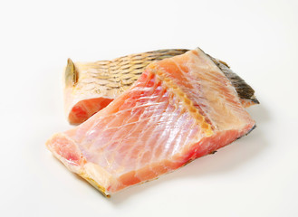 Raw carp fillets