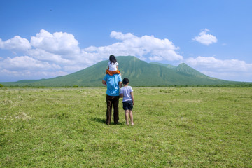 Fototapeta na wymiar Happy family looking at mountain view