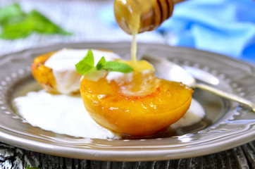 Grilled peach with yogurt and honey.