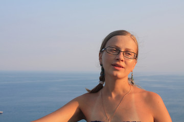 Portrait of a beautiful woman on the sea.