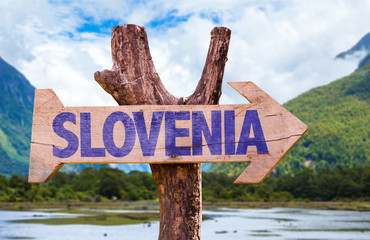 Slovenia wooden sign with mountains background