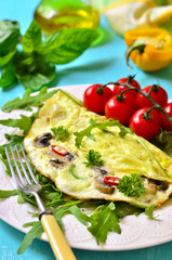 Omelet stuffed with champignon and cheese.