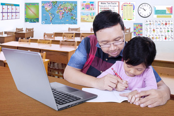 Teacher teach his student to write