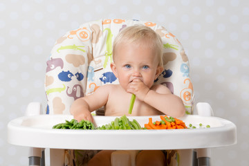 Baby girl eating raw food