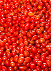 Red Cherry Tomatoes at a produce stand 