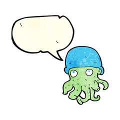 cartoon alien head wearing hat with speech bubble