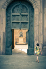 Fototapeta na wymiar Walking to door on statue in Lucca. Tuscany, Italy
