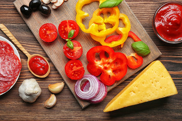 Ingredients for cooking pizza on wooden table, top view