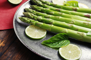 Fresh asparagus on pan, close-up