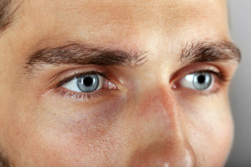 Naklejka premium Beautiful blue man eyes close up