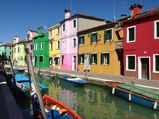 Fototapeta na wymiar Colored houses at a canal in Murano Italy