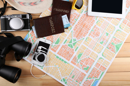 Sunglasses, passports, Digital tablet and map, close up. Preparing for travel concept