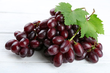 Fresh ripe grapes on wooden table