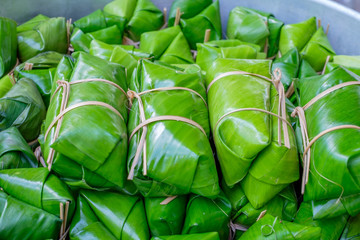 blur Glutinous rice steamed in banana leaf (thai dessert)