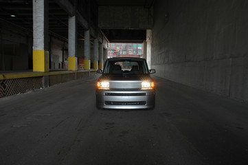 SUV using headlights in tunnel