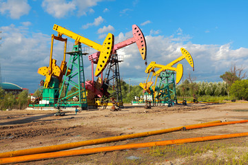 Golden yellow and pink Oil pump of crude oilwell rig