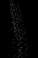 Drops of water on a black background. Texture.